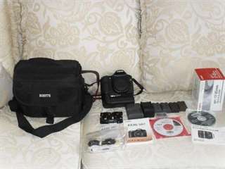 Canon 50D avec batterie grip, lentille et sac de t